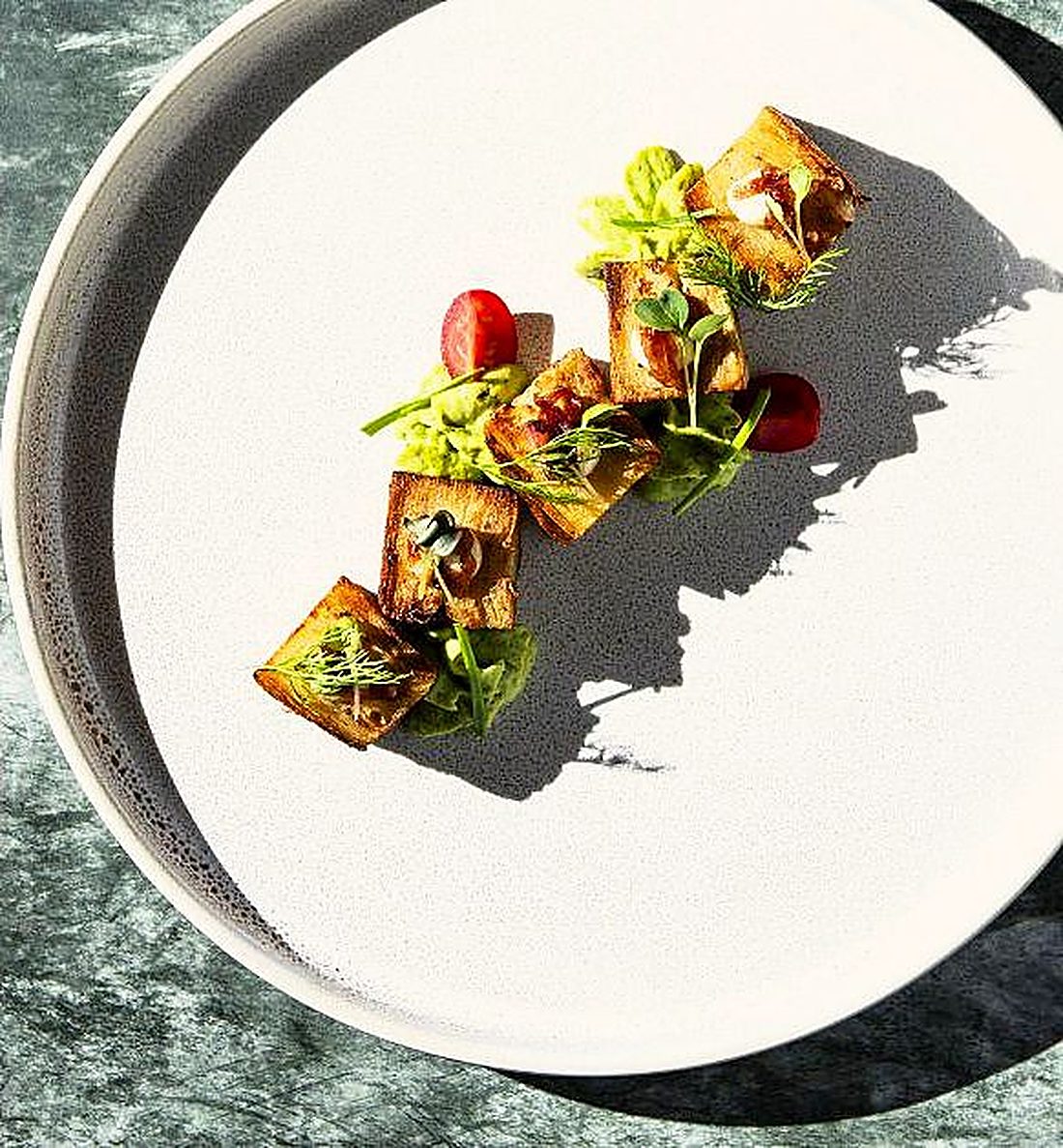 A small plated starter on a white plate